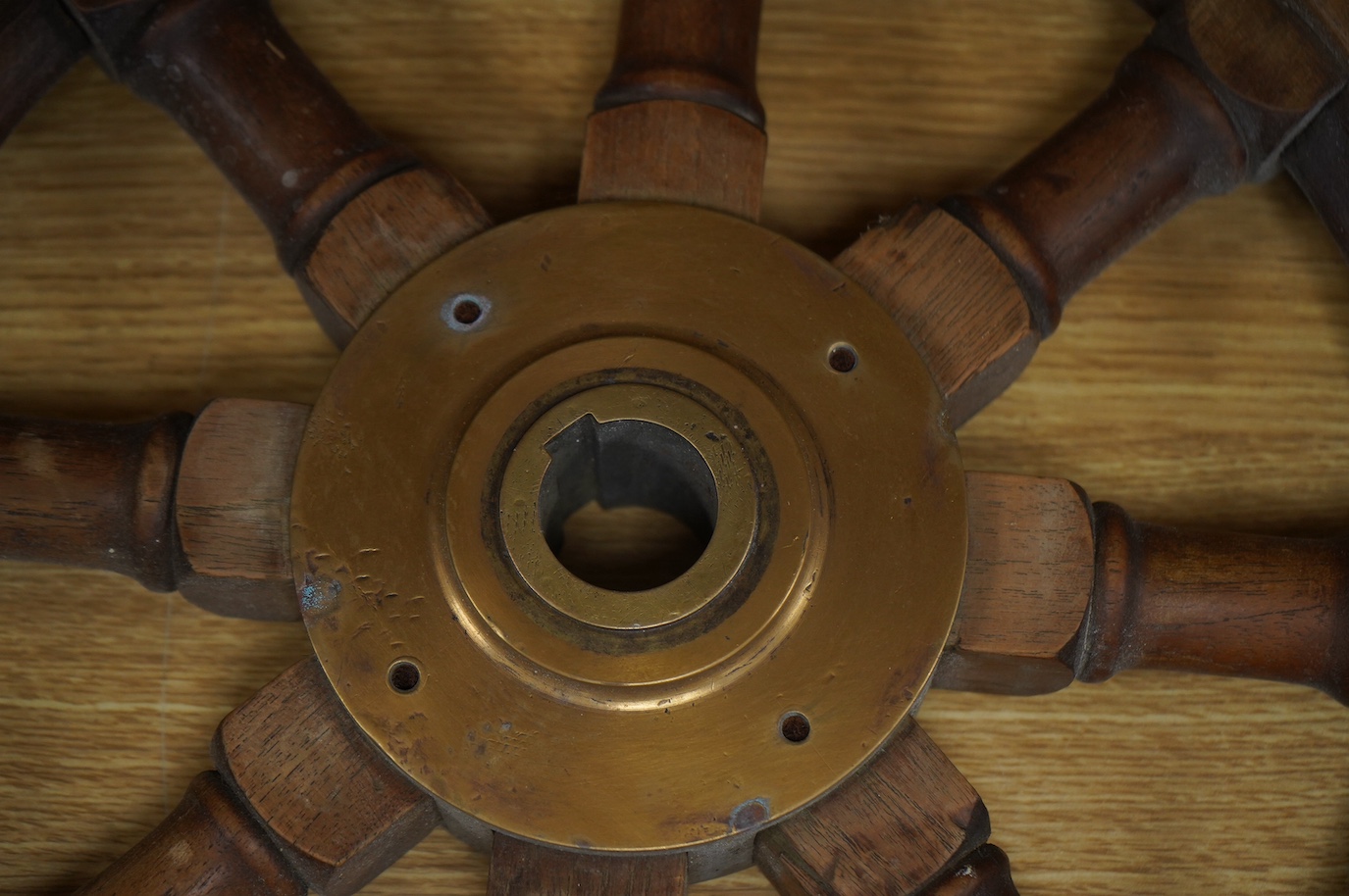 Maritime interest, a brass mounted hardwood ship’s wheel, 68cm in diameter. Condition - fair